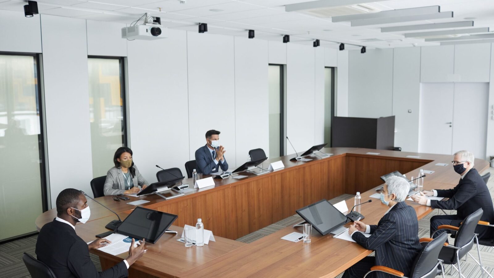 Professionals sitting around a table in a meeting