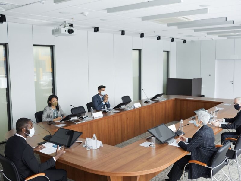 Professionals sitting around a table in a meeting